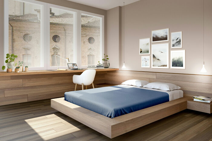 Modern brown bedroom with blue bed, natural light, and stylish decor showcasing expert-approved interior design ideas.