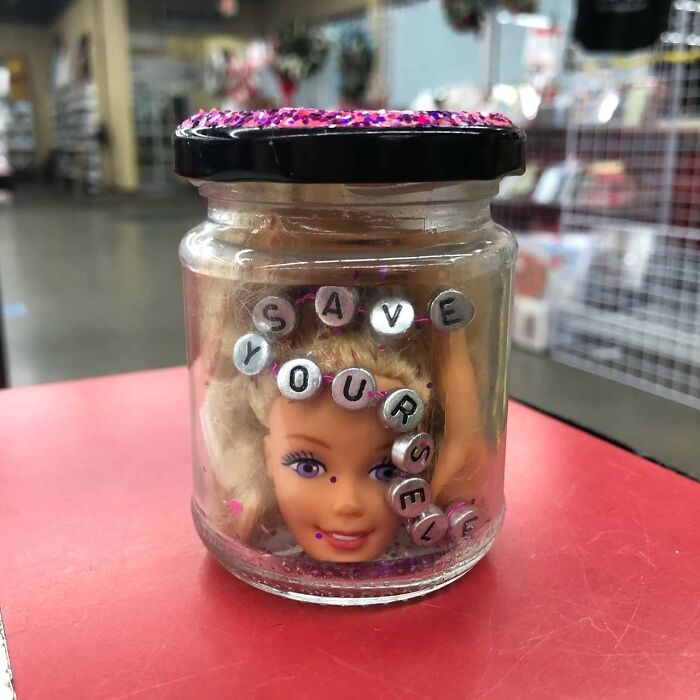 Weird thrift store item featuring a doll head in a jar with beads spelling save yourself on the lid.
