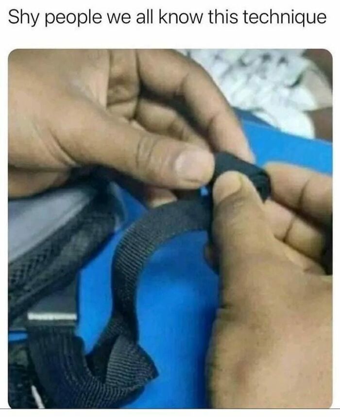 Hands adjusting a strap, illustrating a painfully relatable moment for shy people in a funny meme.