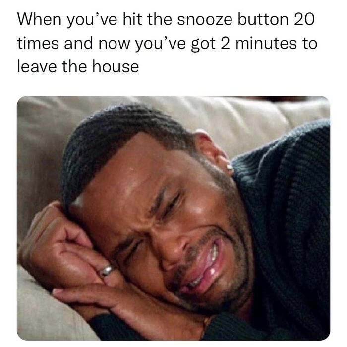 Man crying while lying on a sofa, captures relatable meme humor about oversleeping and rushing.