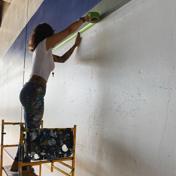 Woman stick a tape on the wall