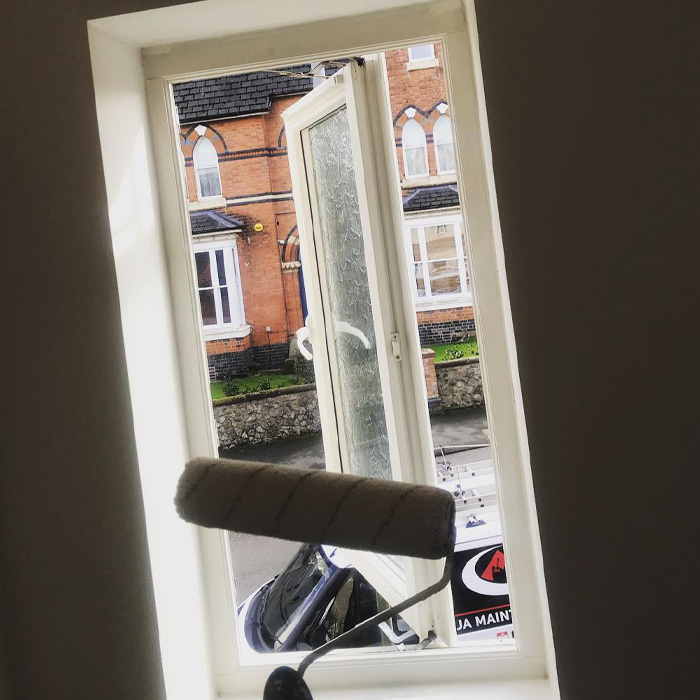 Roller in front of an open window 