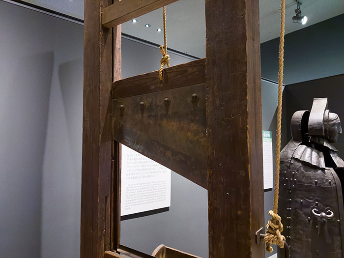 Medieval guillotine exhibit in a museum, representing creepy facts about the world and historical punishments.
