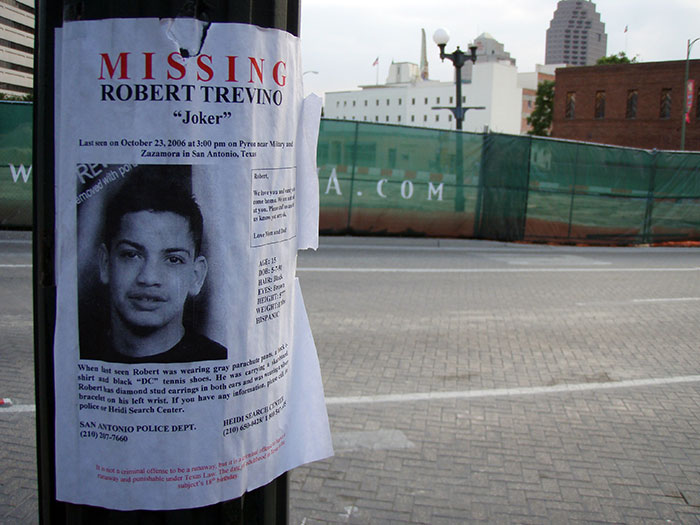 Missing person poster for Robert Trevino on a city street, reflecting creepy facts about the world and disappearances.