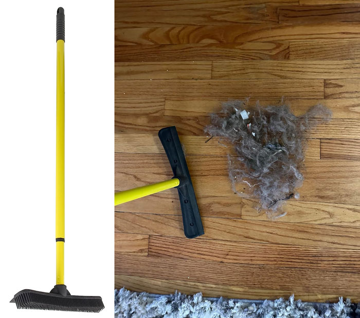 Yellow pet hair remover broom standing next to collected pet hair and debris on a hardwood floor surface.