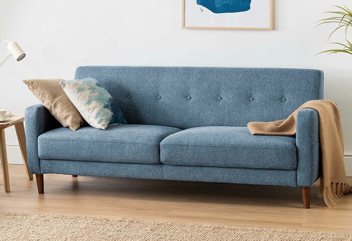 Blue Mellow Adair small couch with cushions and throw, designed to maximize your space in style.
