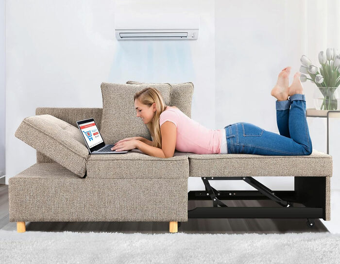 Woman lying on a SEJOV small couch using a laptop, showcasing a stylish and space-maximizing lounge design.