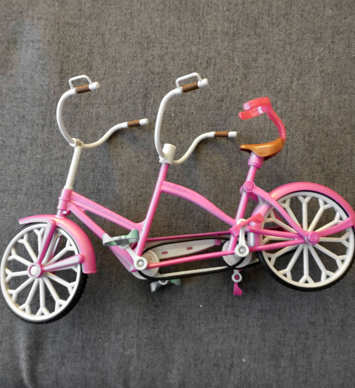 I Guess The Front Barbie Is Sitting On A Bar