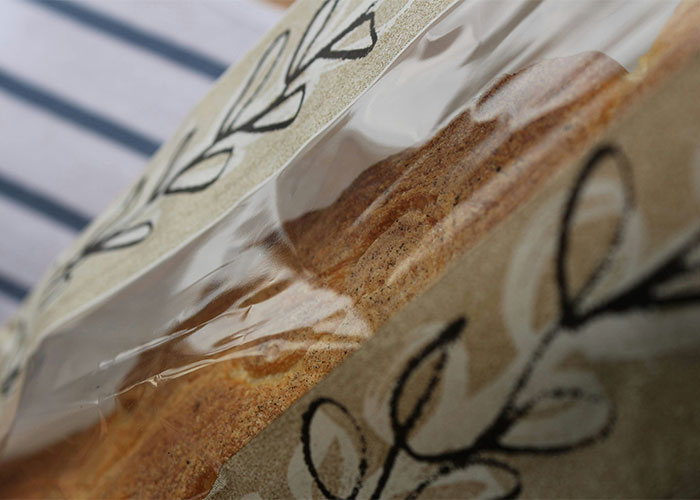 Close-up of bread in eco-friendly packaging highlighting lesser-known frugal tips for saving money on groceries.