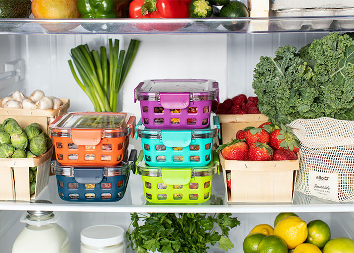 Organized fridge with reusable containers and fresh produce showcasing lesser-known frugal tips for big savings.
