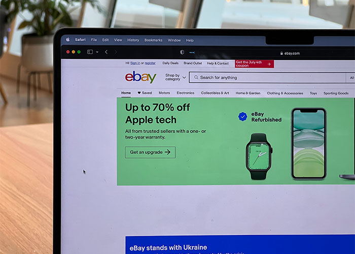 Laptop screen showing eBay website with deals on refurbished Apple tech, illustrating lesser-known frugal tips for saving money online.