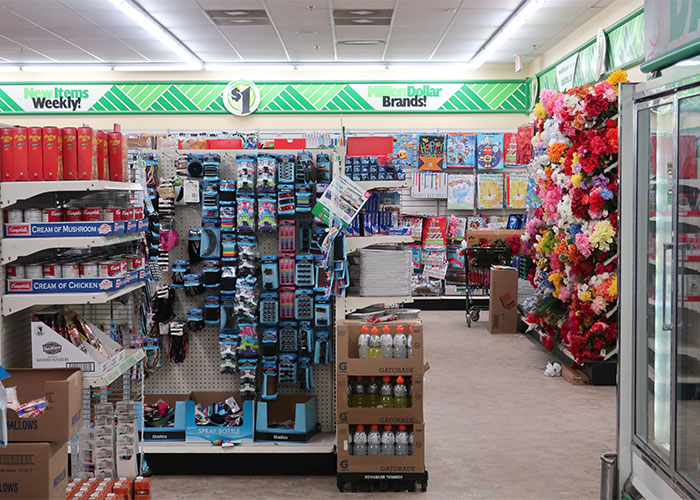 Interior of a discount store aisle displaying frugal tips essentials and affordable items for biggest impact savings.