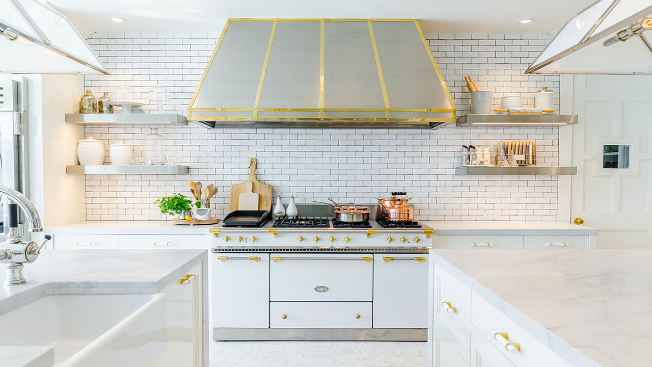Modern kitchen featuring white kitchen cabinets with gold accents and a sleek marble countertop design Modern kitchen featuring white kitchen cabinets with gold accents and a sleek marble countertop design