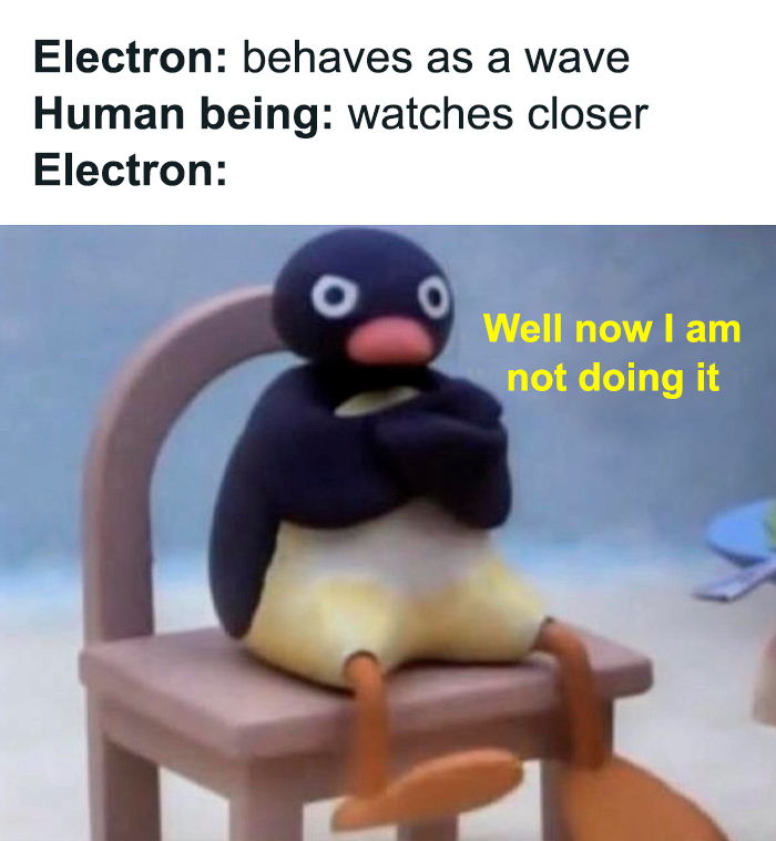 Physics meme with a toy penguin sitting, arms crossed, captioned about electron behavior in wave interactions.