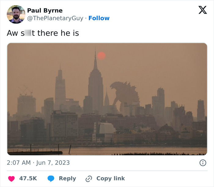 Funny meme from 2023 showing a giant creature behind a city skyline at sunset.