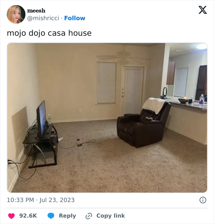 Living room with minimal furniture, TV on stand, recliner chair; a scene from the top funny memes of 2023.