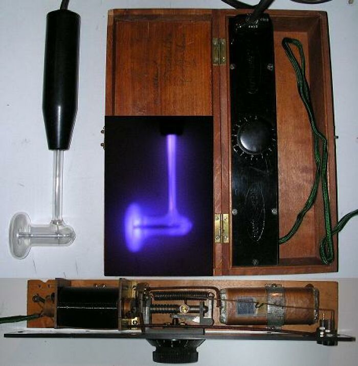 Vintage electrical device with glowing purple plasma tube found among weird surprises after moving into a new home.