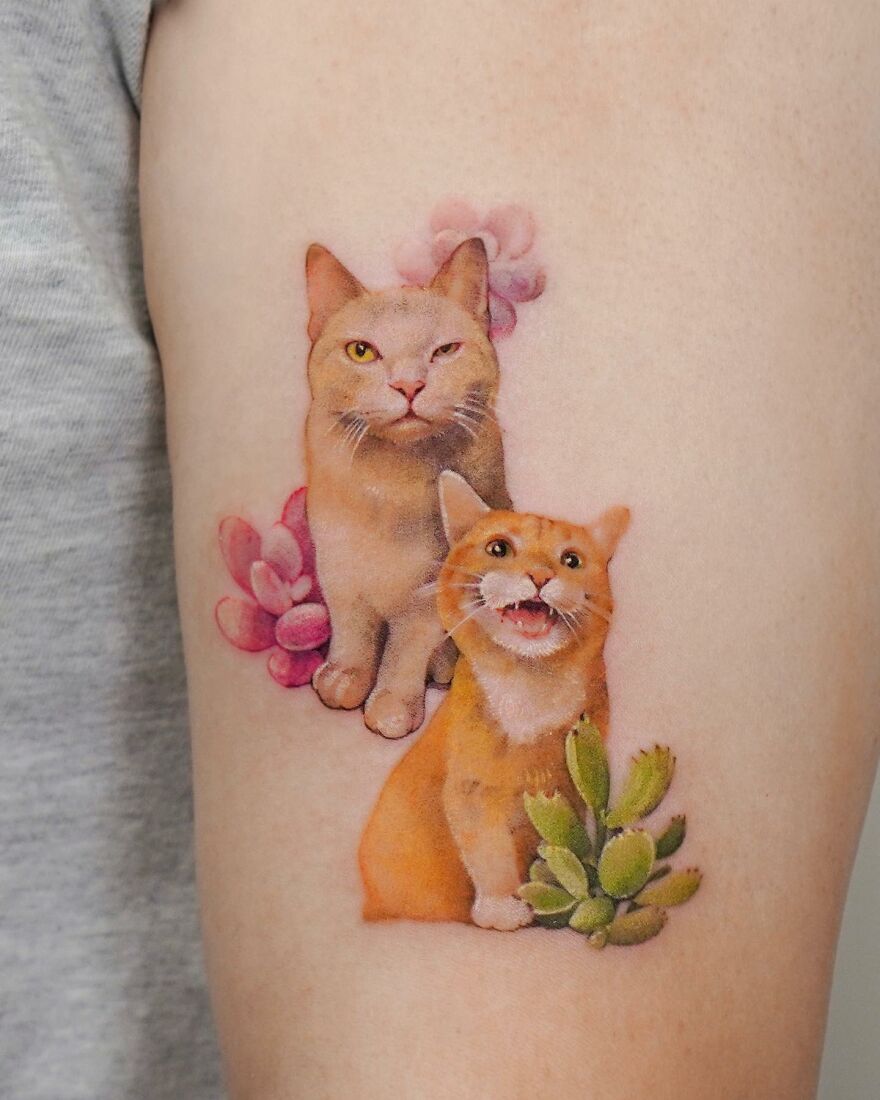 Tattoo of two cats with flowers, blending nature and animals in a painting-like style by a Korean ink artist.
