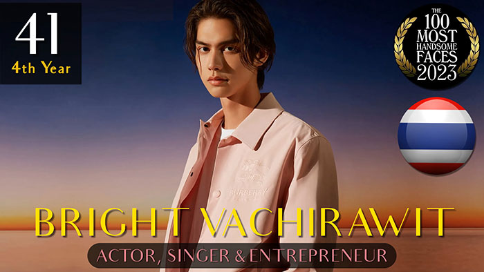 Bright Vachirawit, ranked among the most handsome men of 2023, in a stylish outfit with sunset background.
