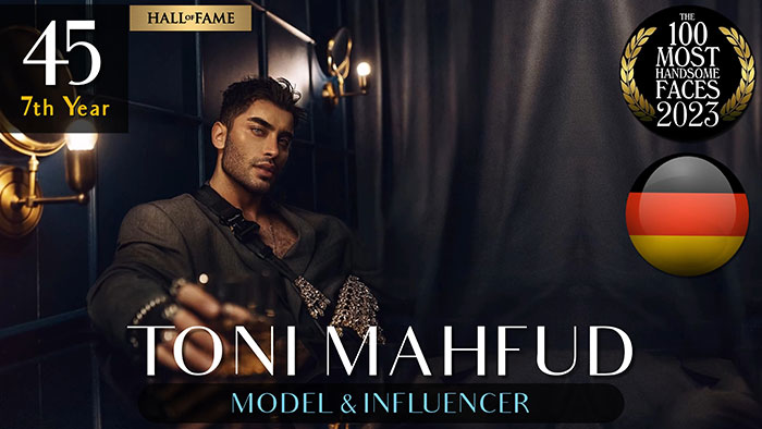 Model Toni Mahfud, featured in the 2023 Most Handsome Men ranking by The Independent Critics, posing in a stylish setting.