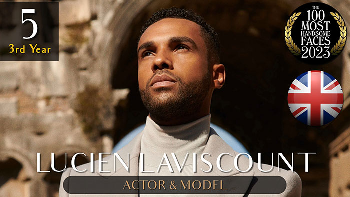 Actor and model ranked among the most handsome men of 2023, set against a dramatic outdoor backdrop.