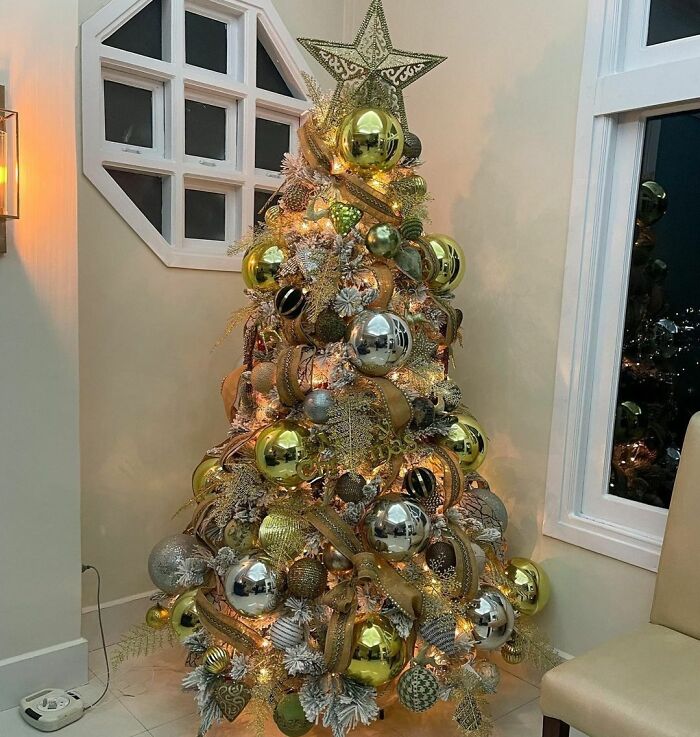 Christmas tree decorated with large baubles and lights showcasing affordable Christmas decor ideas for 2024.
