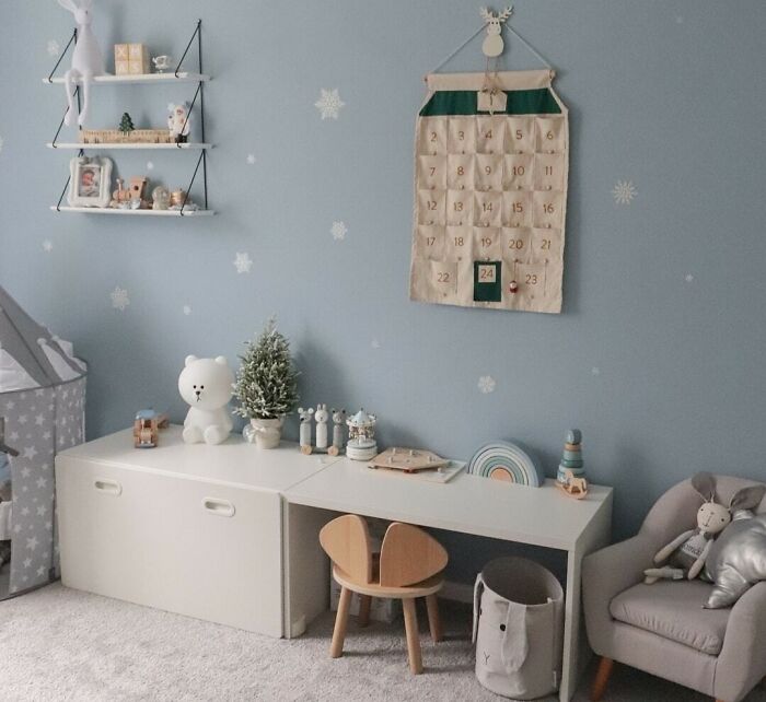 Advent calendar on wall in kids room showcasing affordable Christmas decor ideas for a festive and budget-friendly holiday.