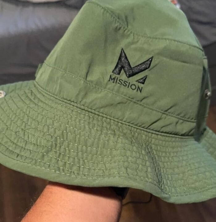 Green bucket hat with "Mission" logo, a unique gift idea for fathers.