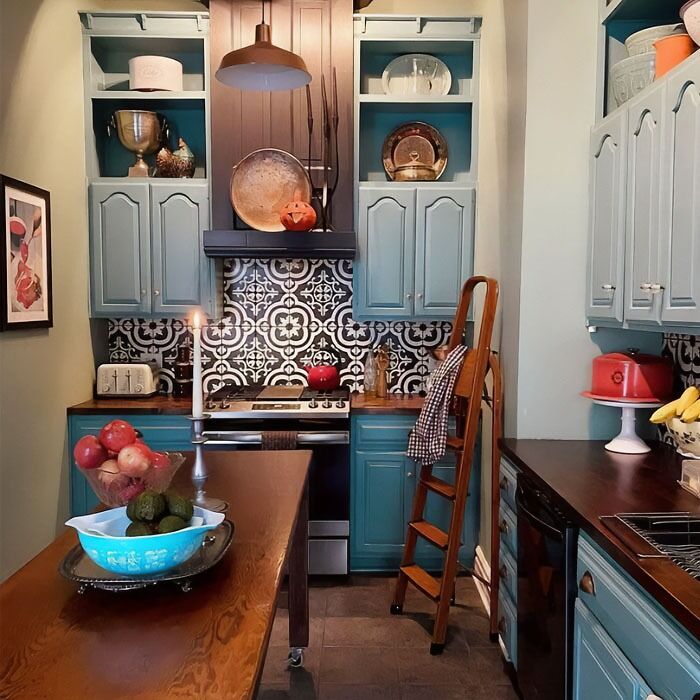 Light blue kitchen cabinets with mozaic tiles