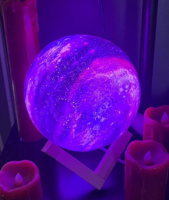 Purple moon lamp glowing with red candles, perfect Christmas gift idea with Amazon Prime.