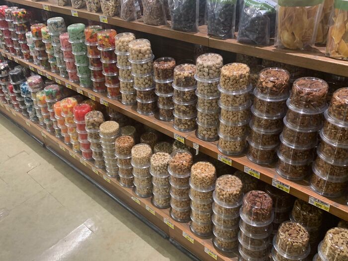 This Grocery Store Displays These Nuts And Other Snacks Upside Down So You Can See The Contents More Clearly