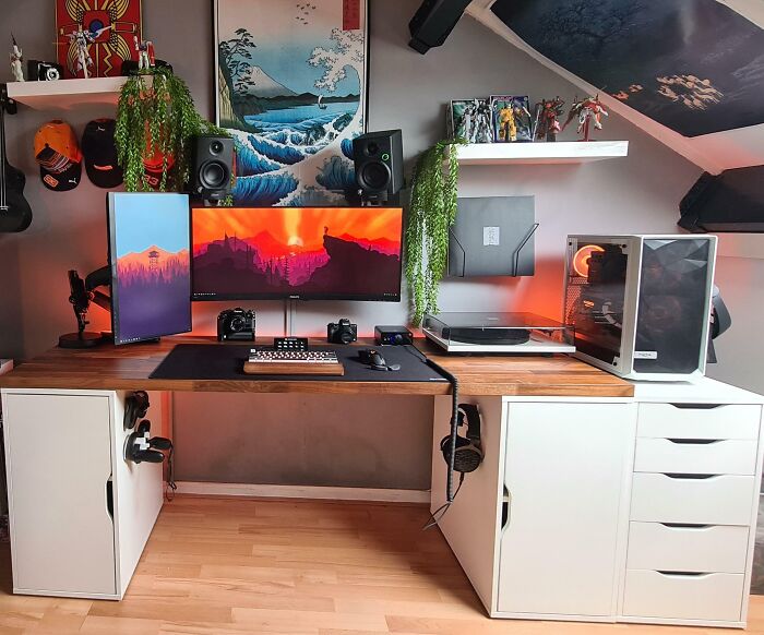 Cozy home office design with dual monitors, wooden desk, plants, and organized tech setup for productivity and comfort.