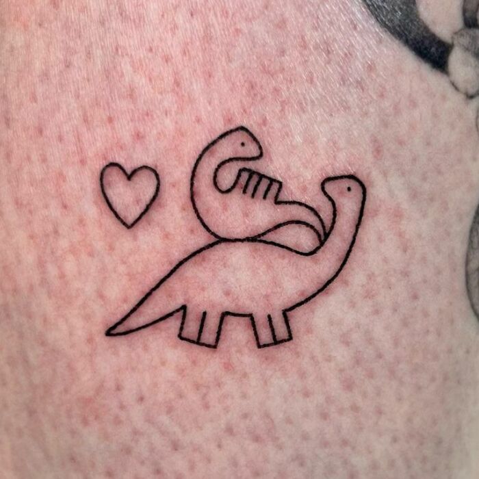 Simple dinosaur tattoo with two dinosaurs and a heart, showcasing cool tattoo ideas.