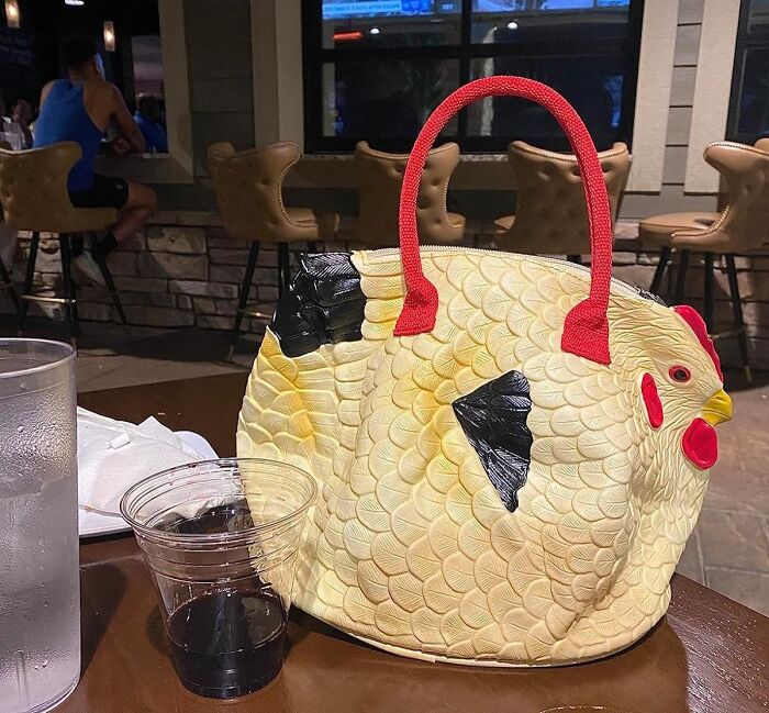 Chicken-shaped handbag on a table, designed to add humor to your product collection in 2024.