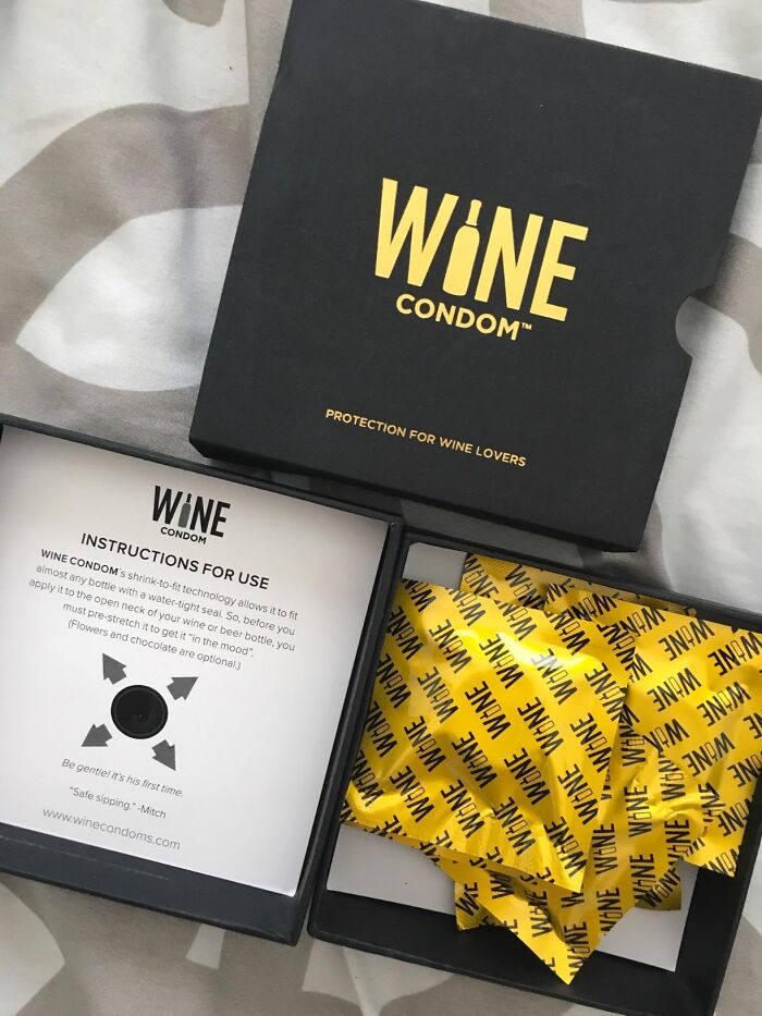 Wine condoms in a black box with yellow wrapping, perfect Christmas gift idea with Amazon Prime.