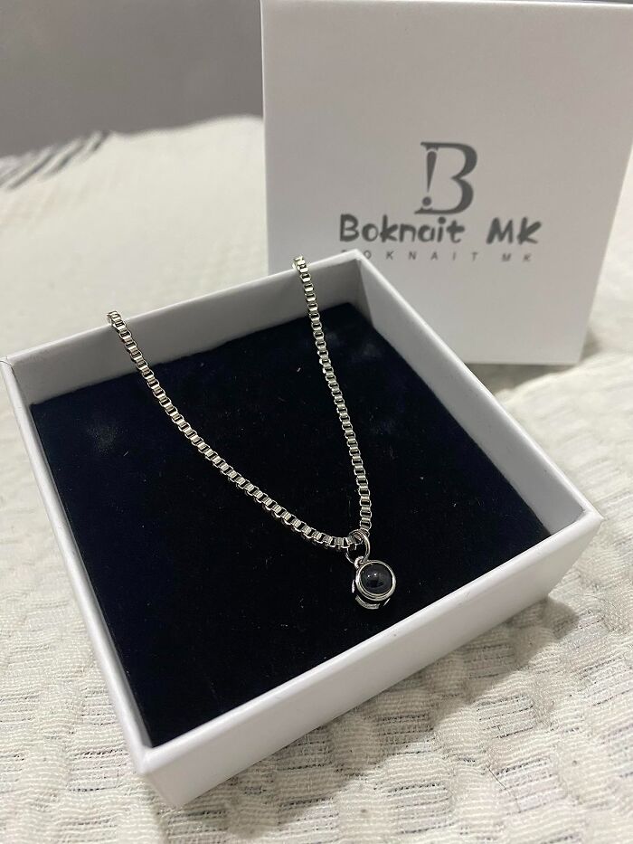 Silver necklace with a small pendant in a gift box, perfect Father's Day finds to spoil your old man.