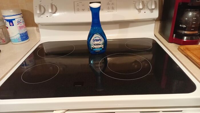 Cleaning product on a stove, part of pre-2025 home cleaning mission.