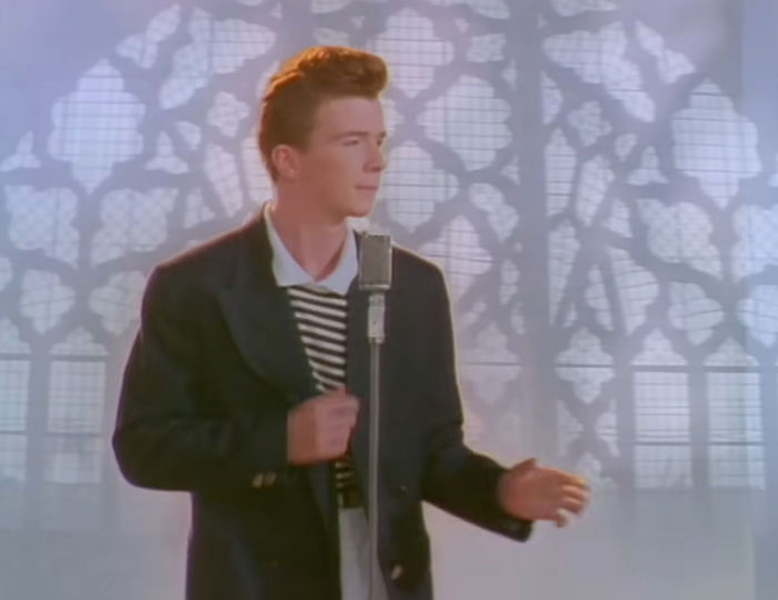 Man dancing and singing into the microphone 