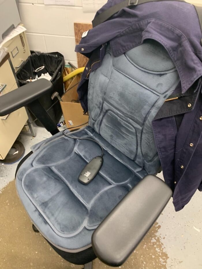 Office chair with a heated massage cushion and remote control, a perfect Father's Day find for comfort and relaxation.