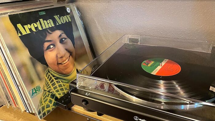 Vinyl record player with Aretha Now album, a unique gift idea for fathers who have everything.