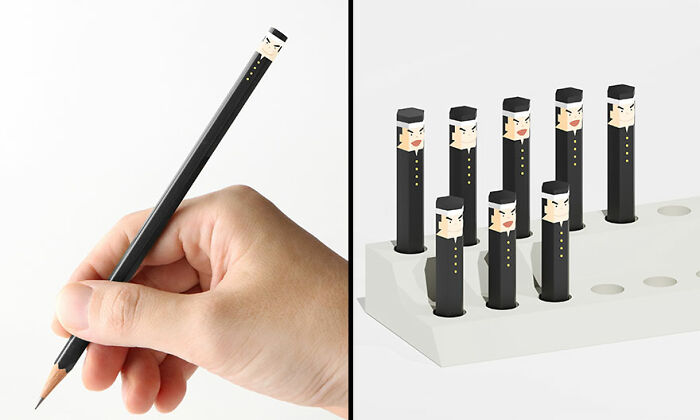 Hand holding a cute and funny everyday invention pencil with multiple character designs in a white holder.