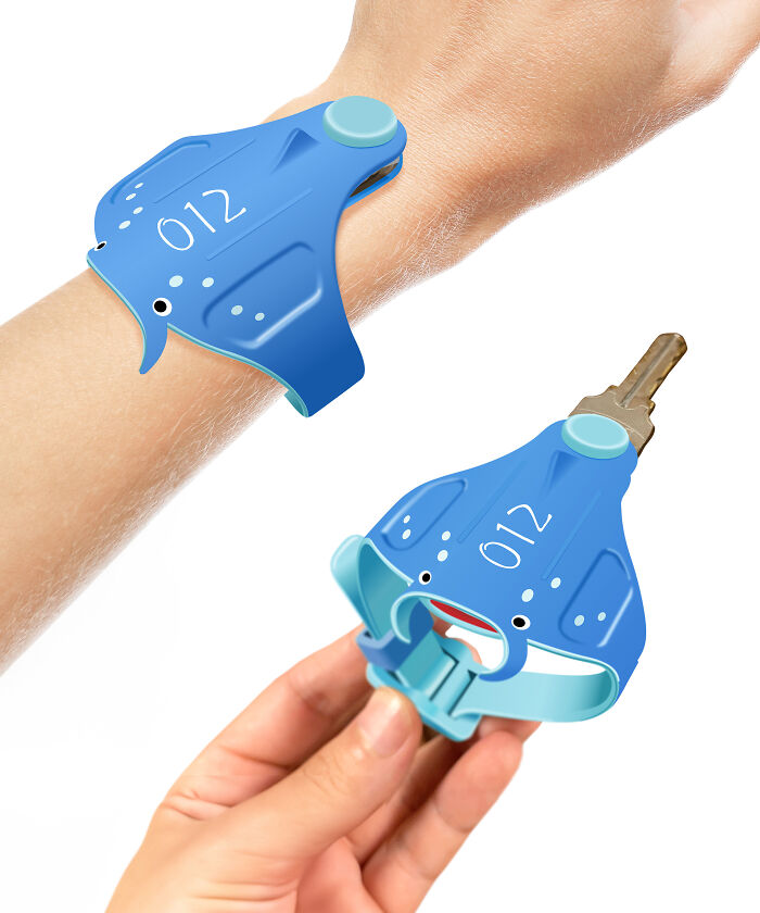Blue everyday invention wristband and key holder shaped like a manta ray, a cute and funny household gadget.