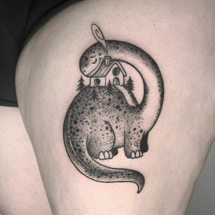 Creative dinosaur tattoo with a house and trees on its back, showcasing a unique and cool design.