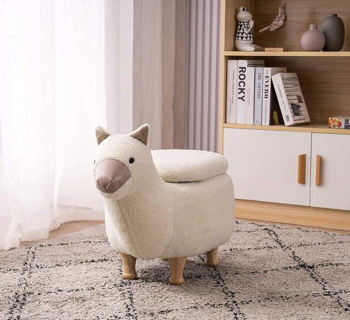 Soft lama ottoman storage placed on soft carpet in the room