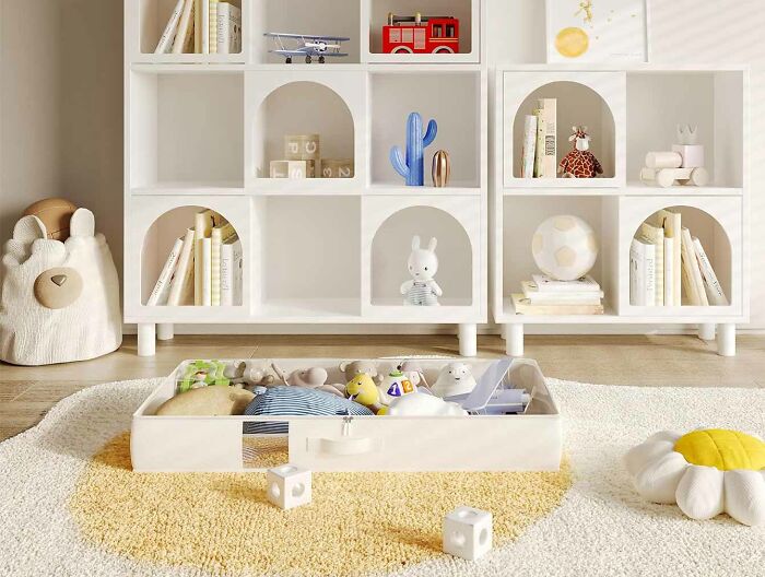 White foldable under-bed toy storage bag placed on the soft carpet