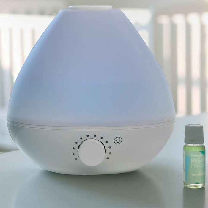 Humidifier near a little bottle with oil