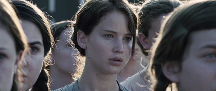 Jennifer Lawrence Standing scared next to other people 