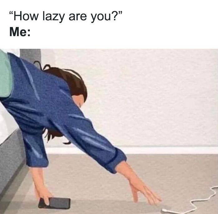 Person lying on a bed, humorously reaching for the phone on the floor, illustrating a relatable meme.