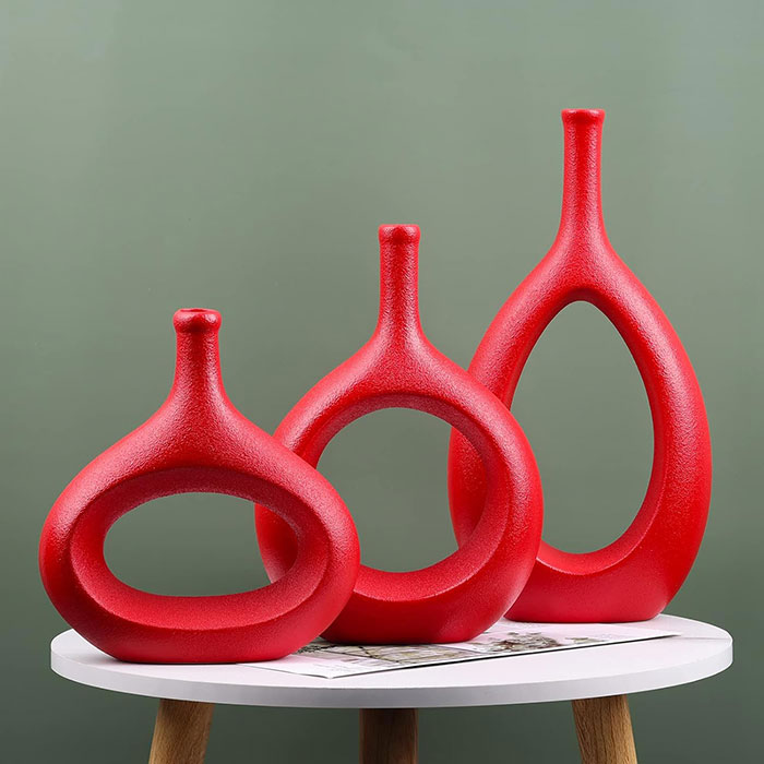 Three Unique res vases on the table 