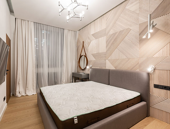 A white mattress on a bed in the bedroom A white mattress on a bed in the bedroom